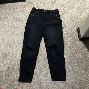 Black mom jeans from American eagle. Rips in both knees.